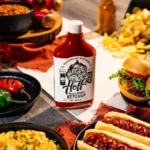 A Bottle of Hoff and Pepper surrounded by food